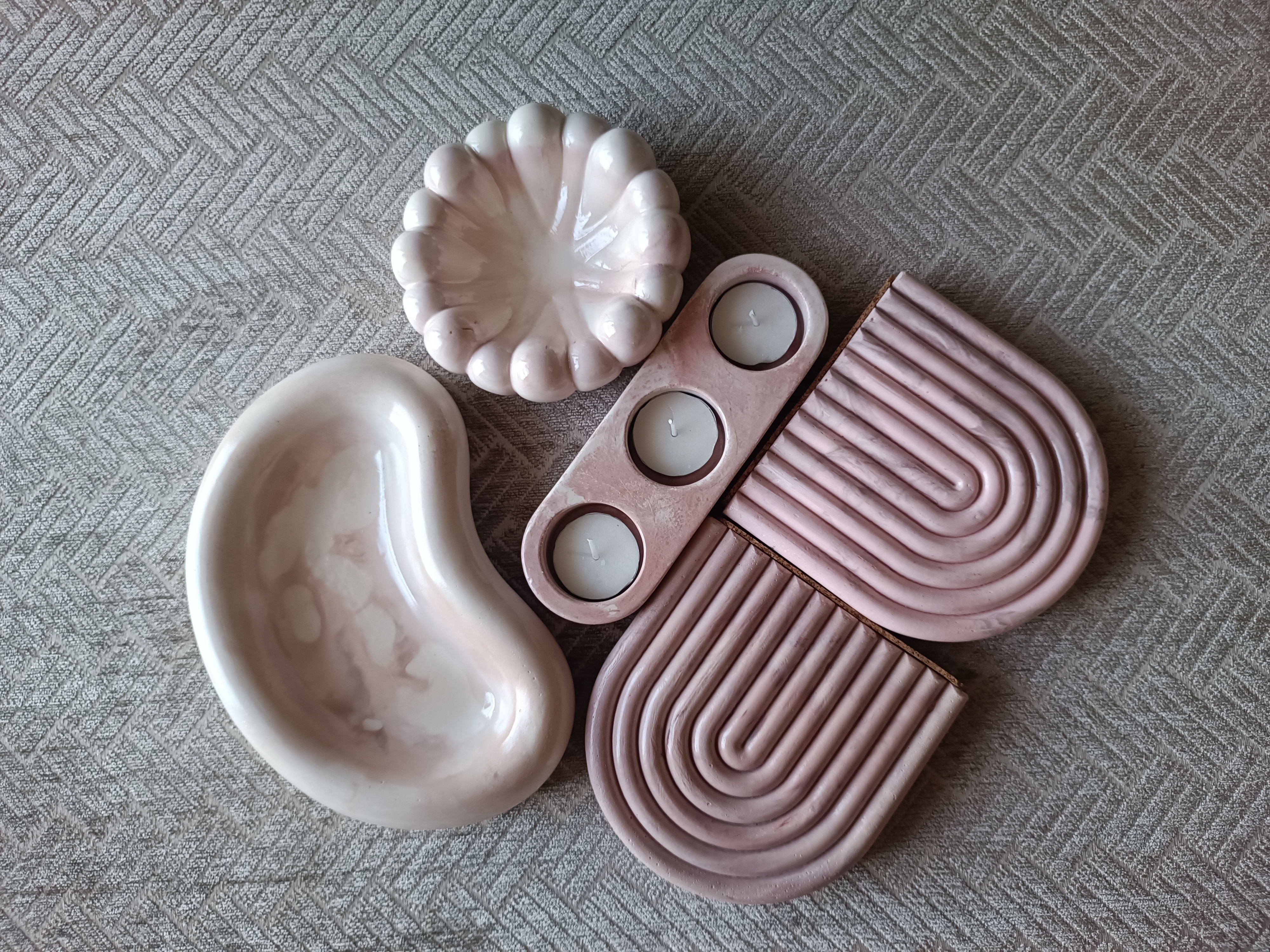 Flatlay of Shruti Nitya ceramic trinket dishes and tealight holders